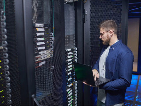tech worker providing Commercial Network Setup in Denver, Colorado Springs, Cheyenne, Boulder, Fort Collins, Vail and Nearby Cities